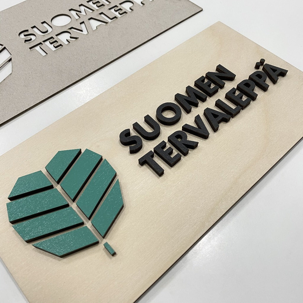Yrityksen Vanerilogo - Logokyltti - puinen - ecodecor.fi.